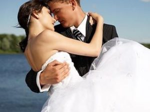 Bride and groom embracing one another