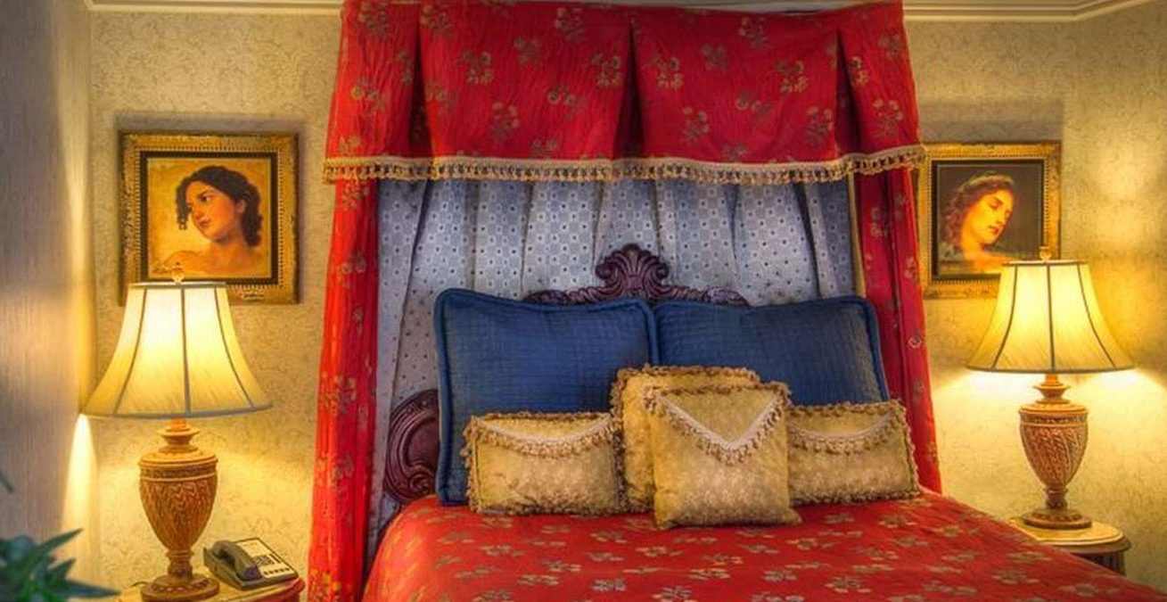 Guest bedroom with red bedding